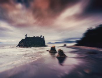Scenic view of sea against sky at sunset