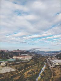 High angle view of road amidst buildings against sky