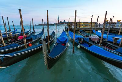 Boats moored in sea