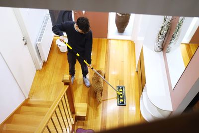 High angle view of man working on staircase at home