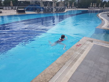 High angle view of man swimming in pool