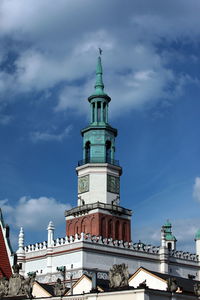 Low angle view of poznan town hall against sky