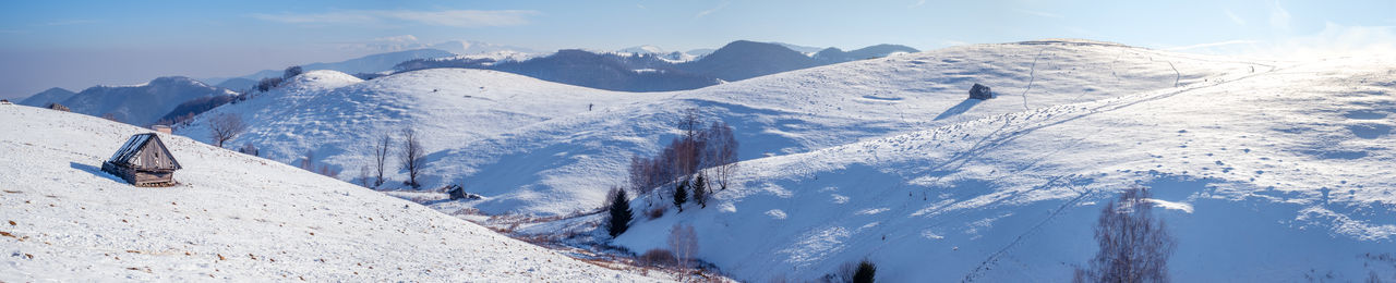 Sun over the winter mountains with snow, cindrel mountains, paltinis, romania