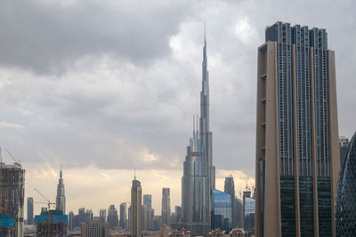 Modern buildings in city against sky