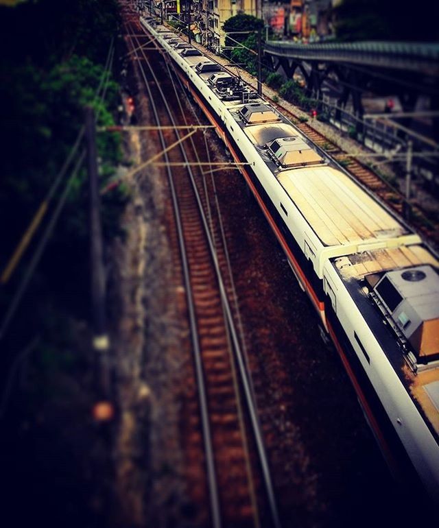 railroad track, transportation, rail transportation, the way forward, diminishing perspective, public transportation, vanishing point, high angle view, railway track, railroad station platform, built structure, architecture, railroad station, train, mode of transport, long, illuminated, connection, train - vehicle, travel