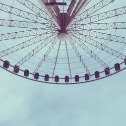 Low angle view of ferris wheel against sky