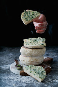 Close-up of stack on table against black background