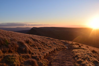 Scenic view of landscape against sky during sunset