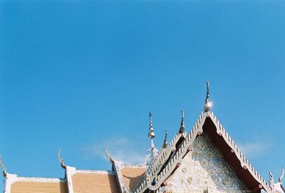 Low angle view of building against blue sky