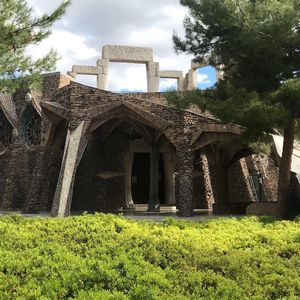 Old building in park against sky