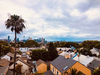 High angle view of houses and trees against sky