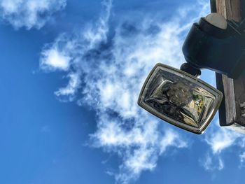 Low angle view of cross against blue sky