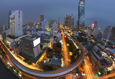 High angle view of illuminated cityscape against sky