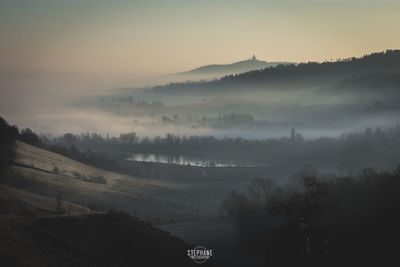 Scenic view of landscape against sky during sunset