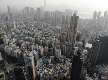 High angle view of modern buildings in city against sky