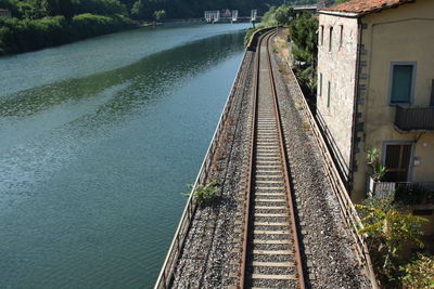 High angle view of railroad tracks by water