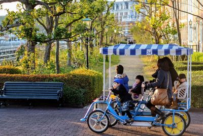 Father sitting on bicycle in city