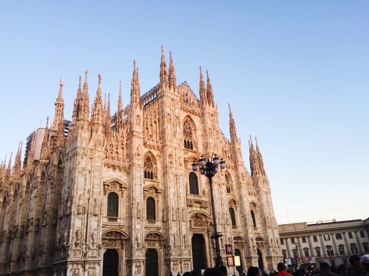 travel destinations, tourism, architecture, clear sky, building exterior, built structure, place of worship, tree, outdoors, sky, large group of people, day, people