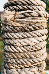 Close-up of ropes tied up on pole