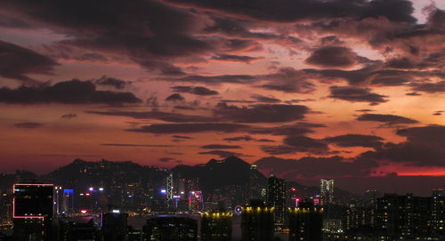 High section of illuminated city against sky at night