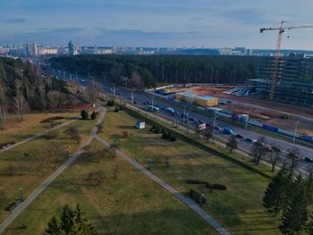 High angle view of vehicles on road against sky