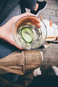 Cropped image of woman holding lemonade glass