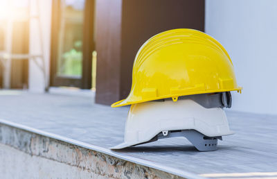 Close-up of yellow hat on building