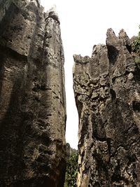 Low angle view of rock formation against clear sky