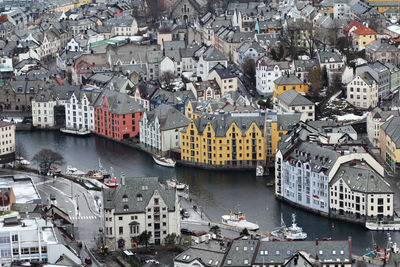 High angle view of harbor by river in city