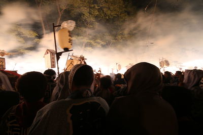 Rear view of people enjoying music concert