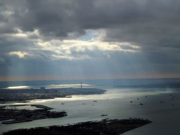 Scenic view of sea against storm clouds