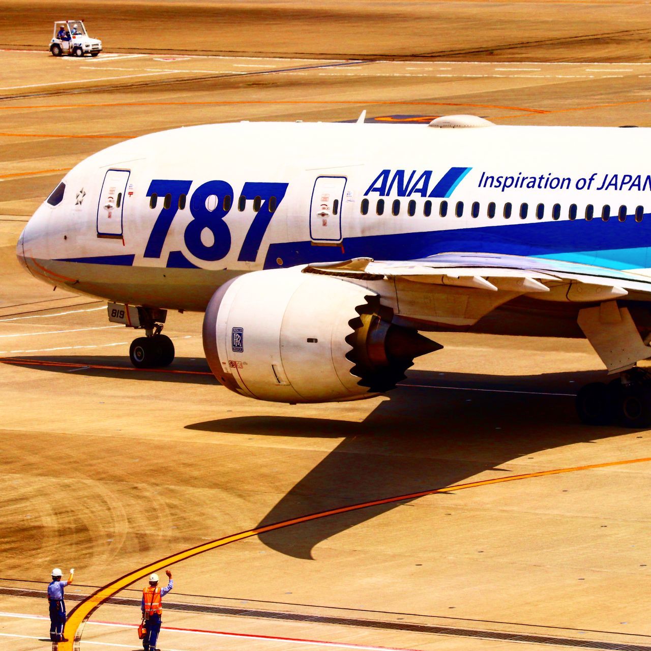 transportation, mode of transportation, air vehicle, airplane, airport, day, airport runway, nature, text, outdoors, real people, travel, road, group of people, people, western script, sunlight, aerospace industry, government, blue