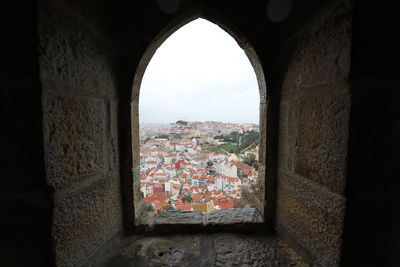 Town seen through arch window