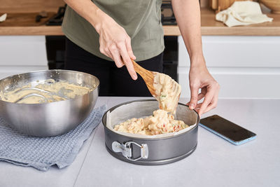 Woman cooking cake at kitchen