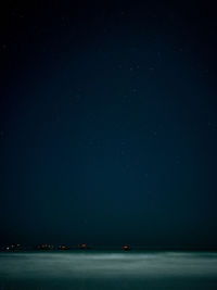 Scenic view of sea against sky at night