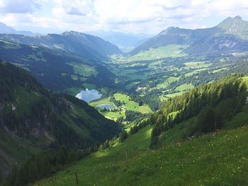 Scenic view of landscape and mountains against sky