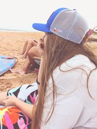 Woman wearing hat on beach
