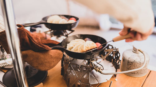 Close-up of man preparing food in kitchen