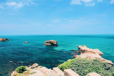 Scenic view of sea against blue sky