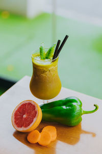 Close-up of orange juice on table