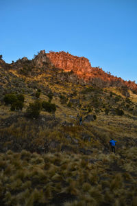 Scenic view of mountains against clear blue sky