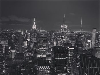 High angle view of buildings against sky at night