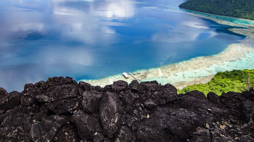 High angle view of rocks in sea