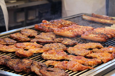 Close-up of meat on barbecue grill