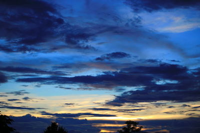 Low angle view of dramatic sky during sunset