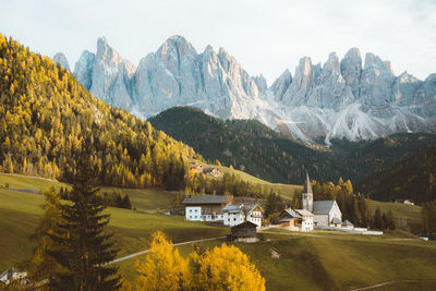 Scenic view of lake by mountains against sky