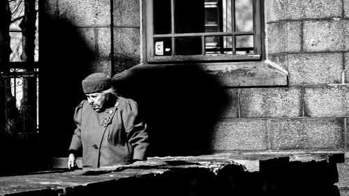 Man standing by window