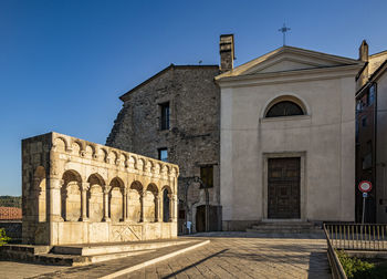 Exterior of historic building against clear blue sky