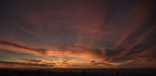 Scenic view of dramatic sky during sunset