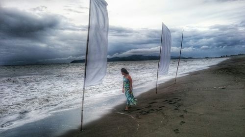 Scenic view of sea against cloudy sky